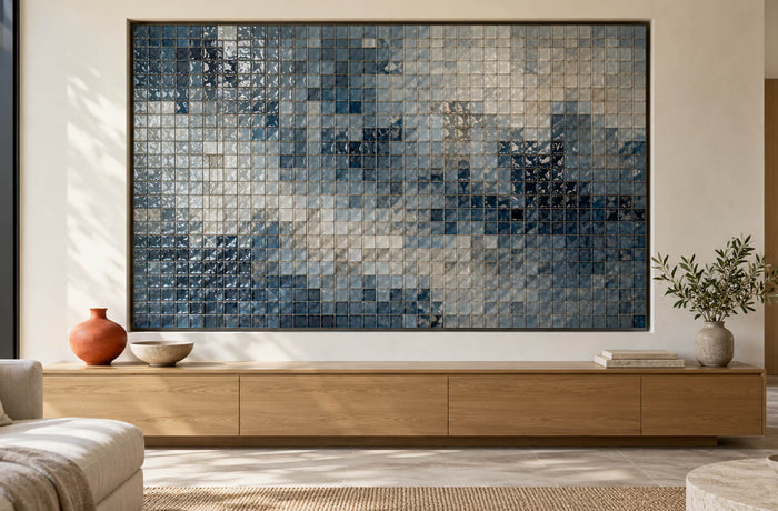 Framed smoky blue glass mosaic accent wall above an oak console in a bright contemporary living room.
