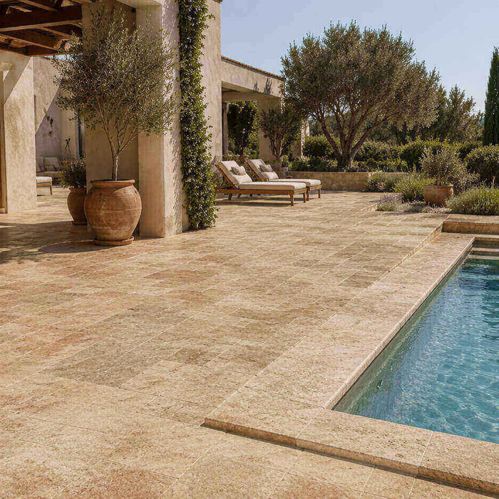 Noce Travertine patio and pool deck with matching pool coping in a Mediterranean outdoor setting