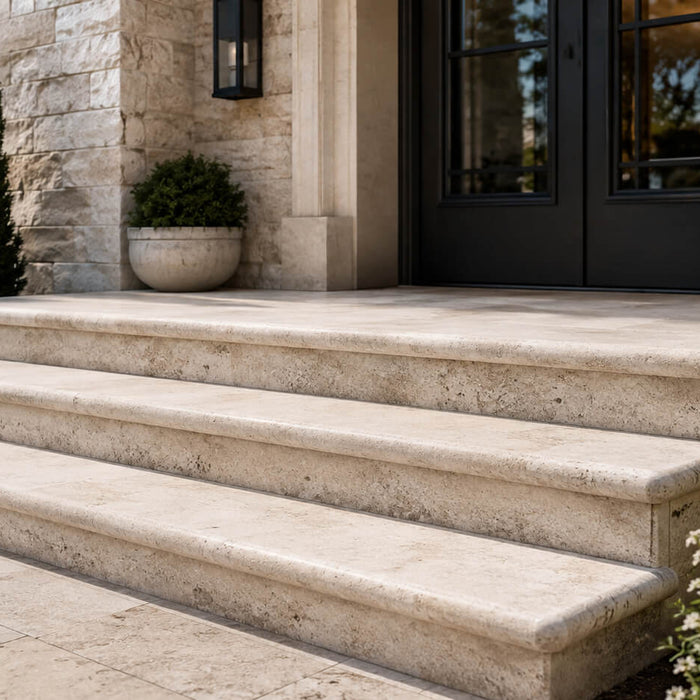 Bullnose stone entry steps with rounded edges at a premium residential entrance