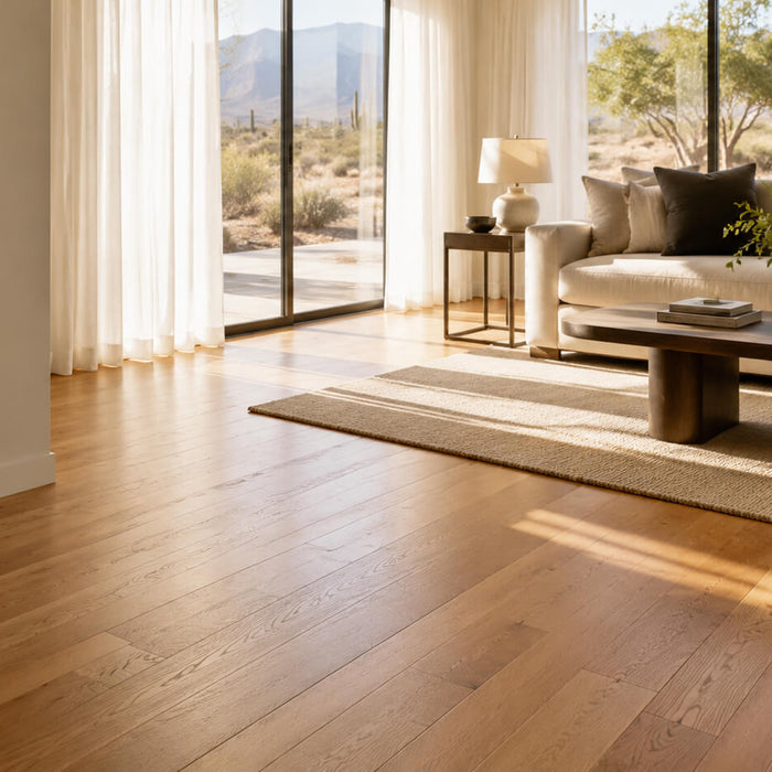 Sunlit modern living room with hardwood flooring in a dry climate home, showing a clean wood floor, soft natural light, and balanced indoor comfort.