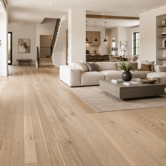 Modern open-concept home showing narrow and wide hardwood plank flooring in a light oak finish
