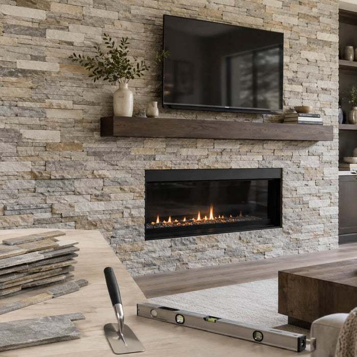Ledger stone installed on a modern interior fireplace wall with natural stacked stone panels