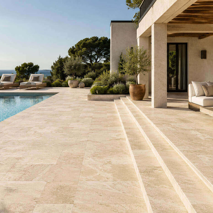 Ivory Travertine outdoor patio and pool deck with warm Mediterranean-inspired landscaping