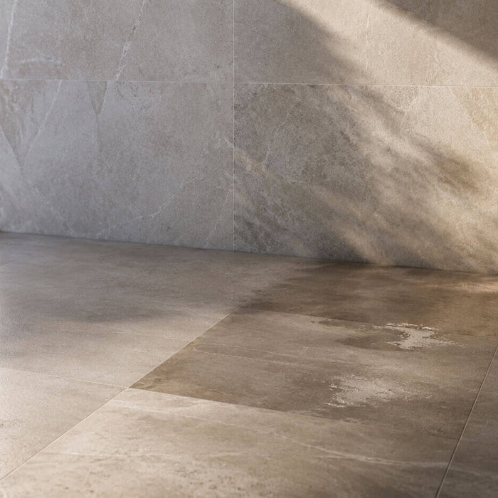 Natural stone floor showing subtle color changes from sunlight, moisture, and everyday exposure