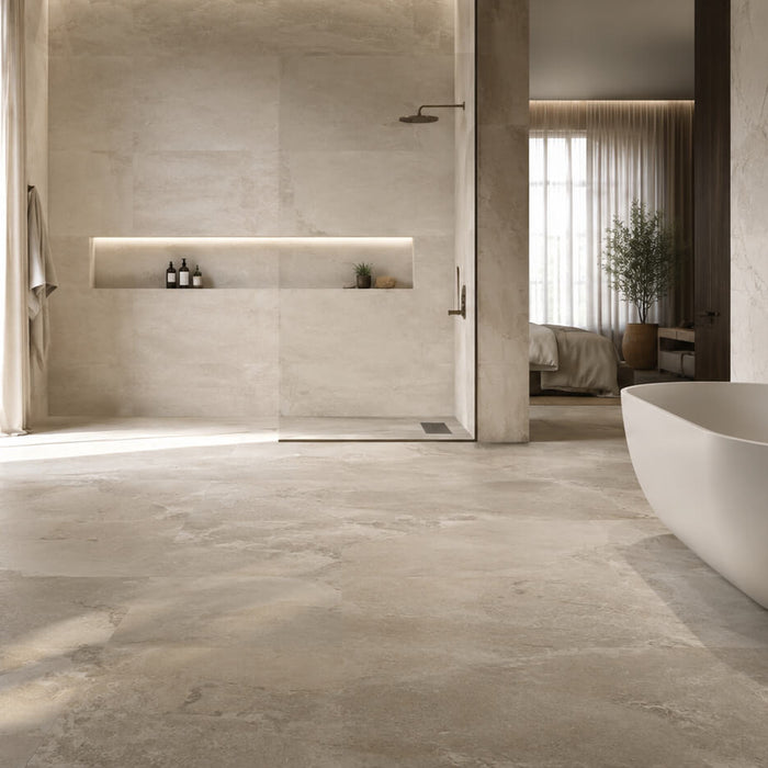 Realistic stone-look porcelain tile in a modern bathroom with marble and limestone-inspired surfaces