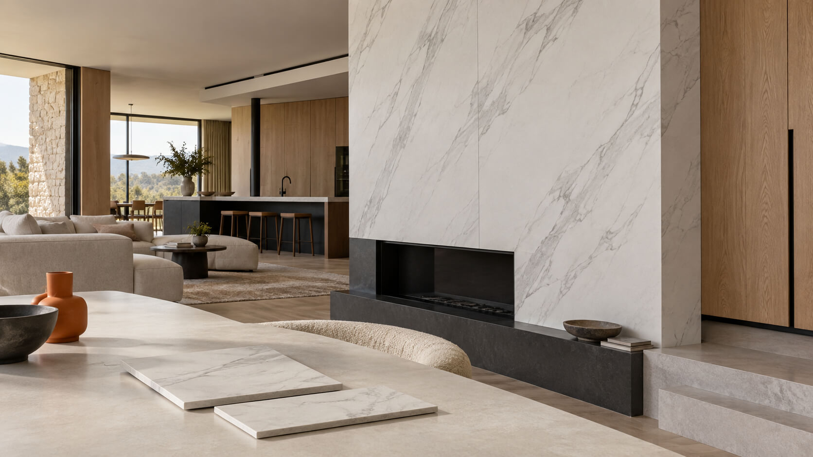 Modern living room with marble-look porcelain wall panels, oak cabinetry, and thin tile samples on a table.