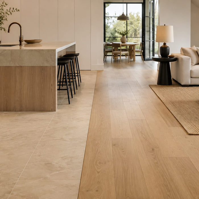 Modern open-concept interior with a seamless transition between light tile flooring and warm hardwood flooring