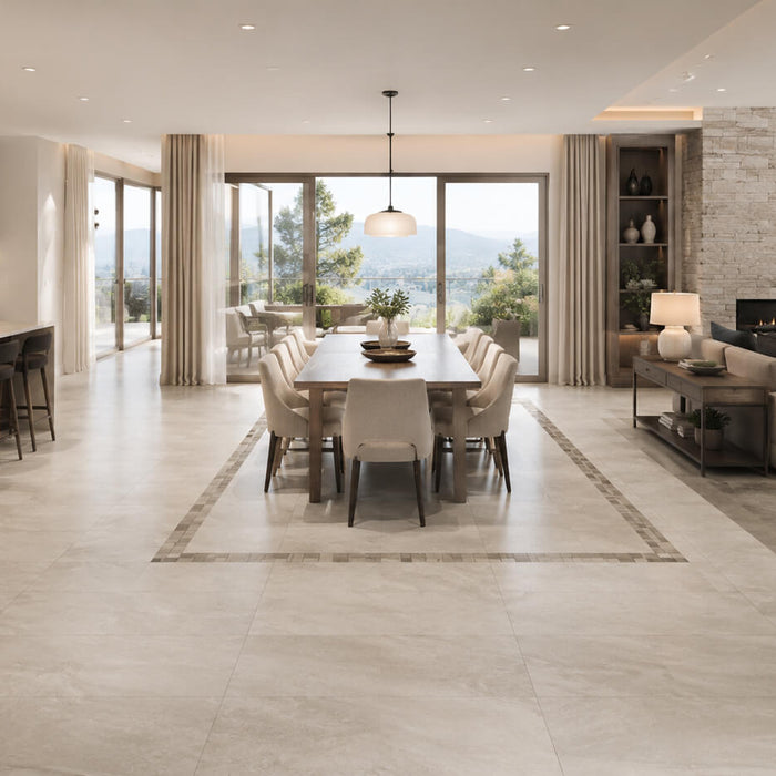 Open-concept kitchen, dining and living room defined with porcelain tile, stone inlay and a natural stone fireplace wall.