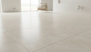 Close-up of Beige Spanishcrema Marfil *Select Marble Honed 24 x 24 x 1/2 Beveled Tile, in Beige tones.