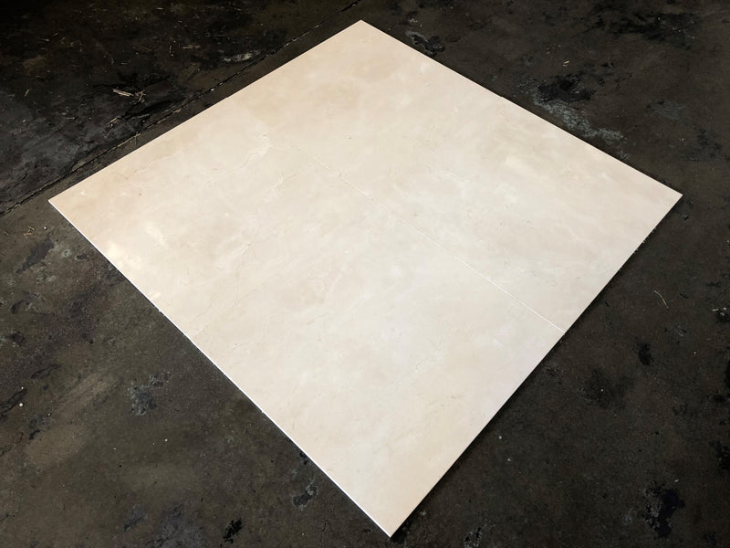 Close-up of Beige Spanishcrema Marfil *Select Marble Polished 24 x 24 x 1/2 Beveled Tile, in Beige tones.