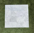 Close-up of Tundra Marble Leather (Sandblasted & Brushed) French Versailles x 1/2 Tile, in Tundra tones.