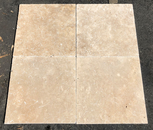 Close-up of Ivory Cordoba Cream Travertine Tumbled 12 x 12 x 3/8 Cross Cut Tile, in Ivory tones.
