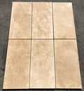 Close-up of Ivory Cordoba Cream Travertine Filled, Honed & Straight Edge 12 x 24 x 1/2 Cross Cut Tile, in Ivory tones.