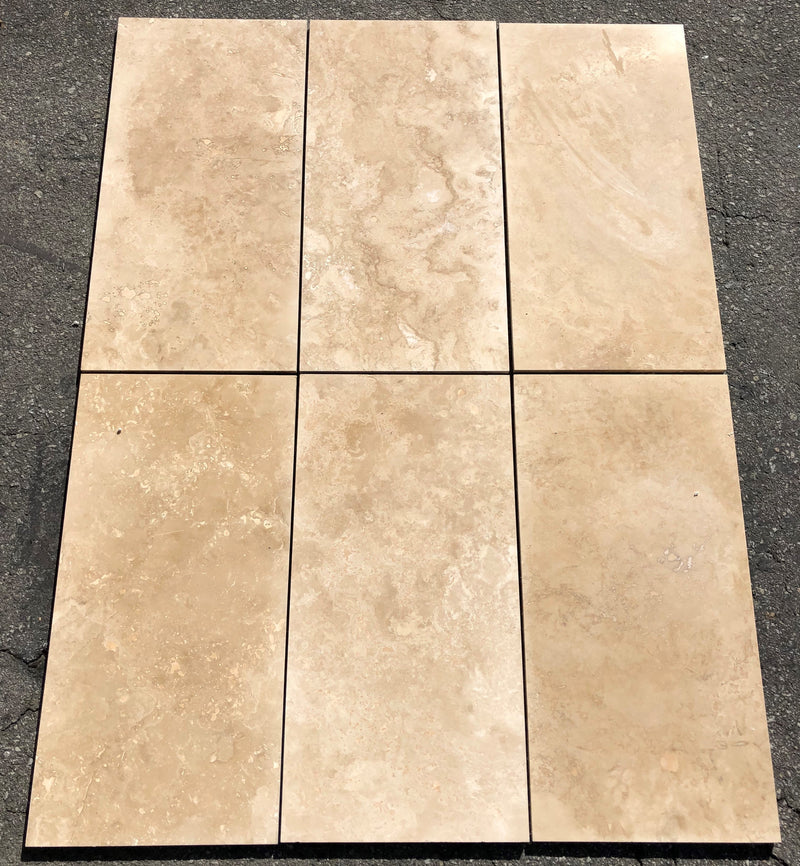 Close-up of Ivory Cordoba Cream Travertine Filled, Honed & Straight Edge 12 x 24 x 1/2 Cross Cut Tile, in Ivory tones.