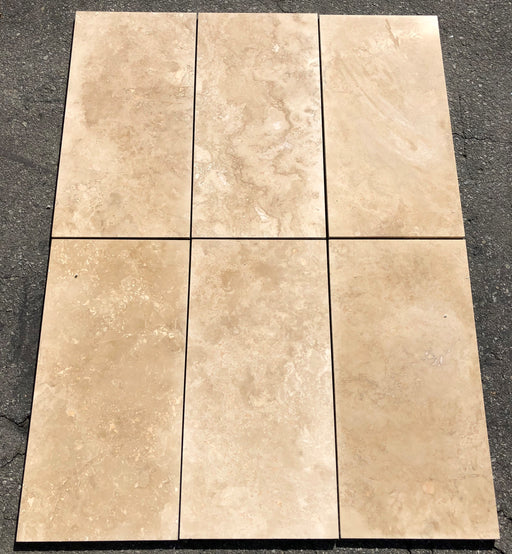 Close-up of Ivory Cordoba Cream Travertine Filled, Honed & Straight Edge 12 x 24 x 1/2 Cross Cut Tile, in Ivory tones.