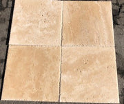 Close-up of Ivory Cordoba Cream Travertine Filled, Honed & Straight Edge 18 x 18 x 1/2 Cross Cut Tile, in Ivory tones.