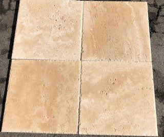 Close-up of Ivory Cordoba Cream Travertine Filled, Honed & Straight Edge 18 x 18 x 1/2 Cross Cut Tile, in Ivory tones.