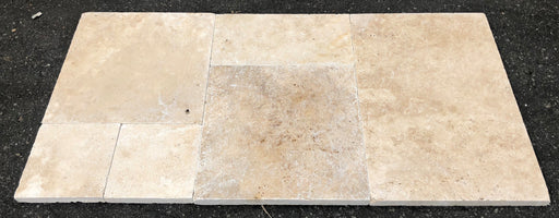 Close-up of Ivory Cordoba Cream Travertine Filled, Honed & Straight Edge French Versailles x 1/2 Cross Cut Tile, in Ivory tones.