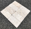Close-up of Ivory Cordoba Cream Travertine Tumbled 3 x 6 x 3/8 Cross Cut Tile, in Ivory tones.