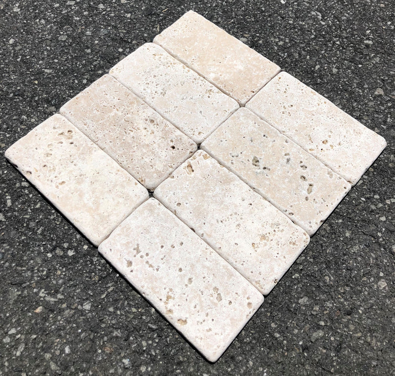 Close-up of Ivory Cordoba Cream Travertine Tumbled 3 x 6 x 3/8 Cross Cut Tile, in Ivory tones.