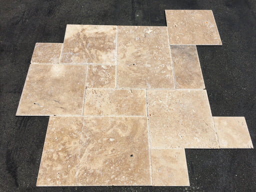 Close-up of Chocolate Brown Walnut Travertine Unfilled, Brushed & Chiseled French Versailles x 1/2 Cross Cut Tile, in Brown tones.