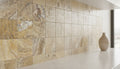 Close-up of Autumn Leaves Scabos Travertine Tumbled 6 x 6 x 3/8 Cross Cut Tile, in Autumn tones.