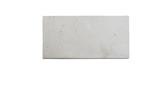 Close-up of Desert Sand Limestone Filled, Honed & Straight Edge 12 x 24 x 1/2 Cross Cut Tile, in Desert Sand tones.