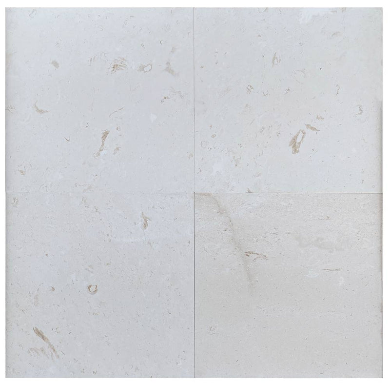 Close-up of Desert Sand Limestone Filled, Honed & Straight Edge 24 x 24 x 1/2 Cross Cut Tile, in Desert Sand tones.