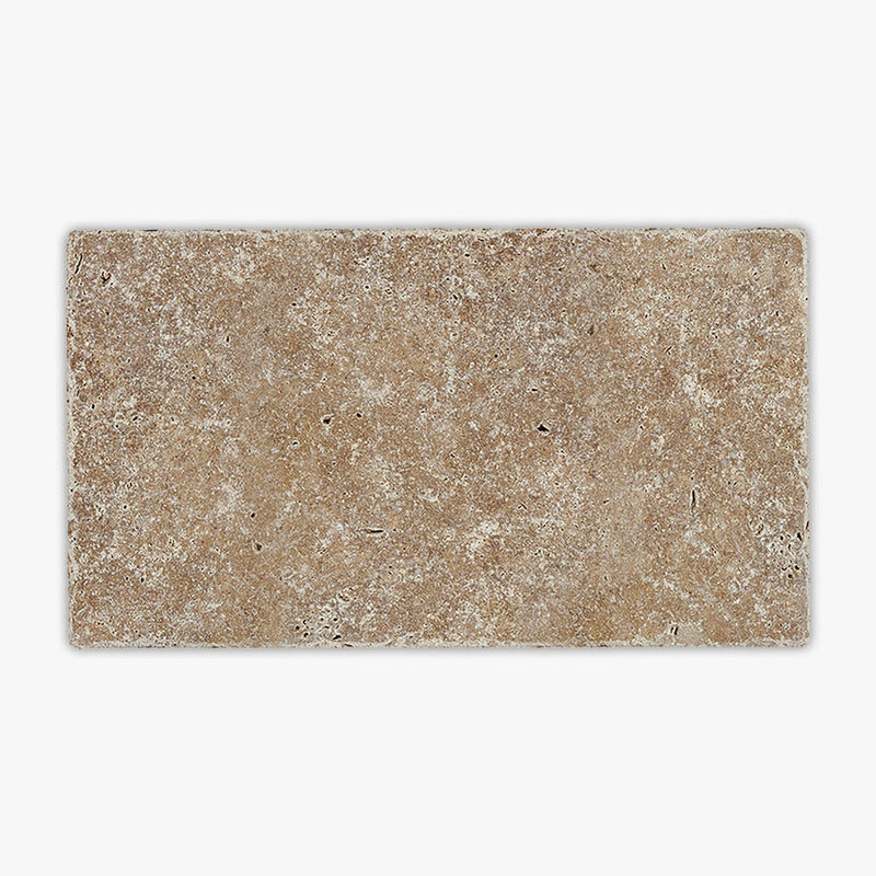 Close-up of Noce Travertine Tumbled 6 x 12 x 1.25 Paver, in Noce tones.