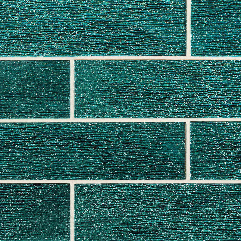 Anacapri 3x12 teal glass tile with horizontal textured ridges in a staggered brick pattern.