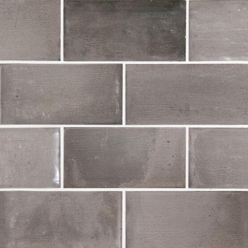 APE Lautia Anthracite 3x6 glossy ceramic tiles in a staggered brick layout.
