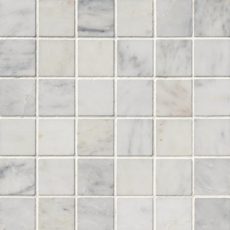 Arabescato Carrara 2x2 honed marble mosaic tile with white and light gray square pieces and natural gray veining.