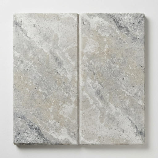 Arctic Silver 12x24x2 Tumbled Travertine Single Bullnose Pool Coping close-up