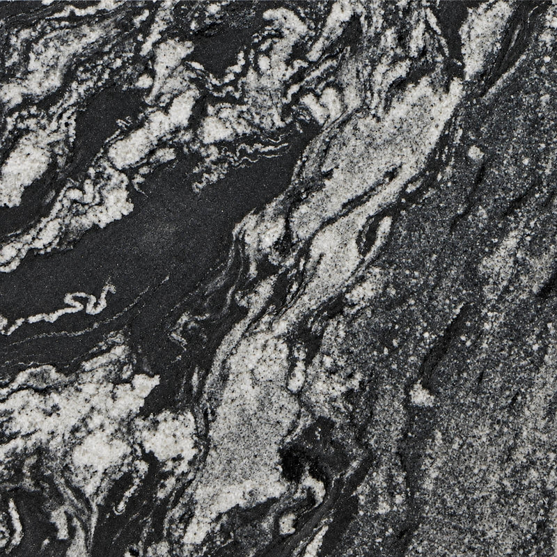 Atacama Black polished granite with flowing black and silver-white mineral patterns.