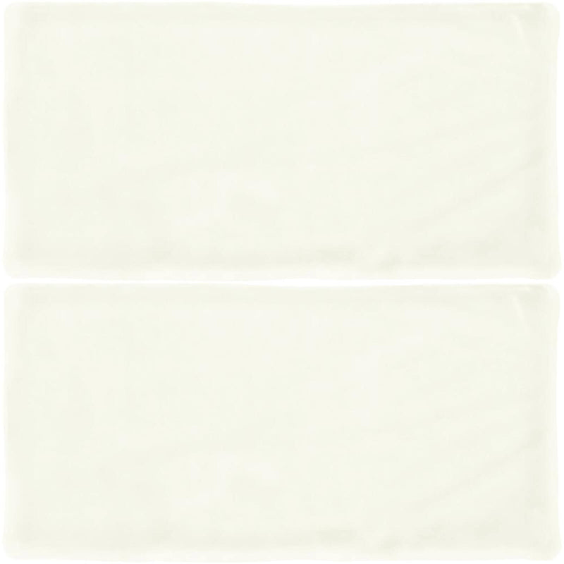 Atelier White matte ceramic tiles with softly uneven edges, a pale white surface and subtle handmade texture, shown as two tiles.