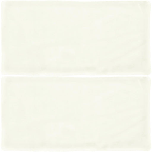 Atelier White matte ceramic tiles with softly uneven edges, a pale white surface and subtle handmade texture, shown as two tiles.