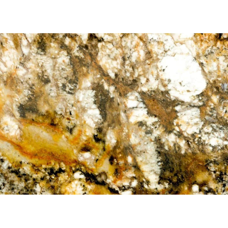 Audax polished granite surface with golden brown areas, pale mineral clusters and dark crystalline markings throughout the stone.
