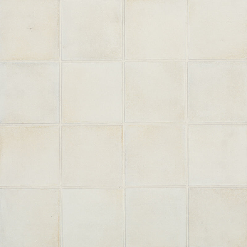 Barely There In The Cloud matte square tiles with soft ivory tones, subtle earthen mottling and gently irregular edges.