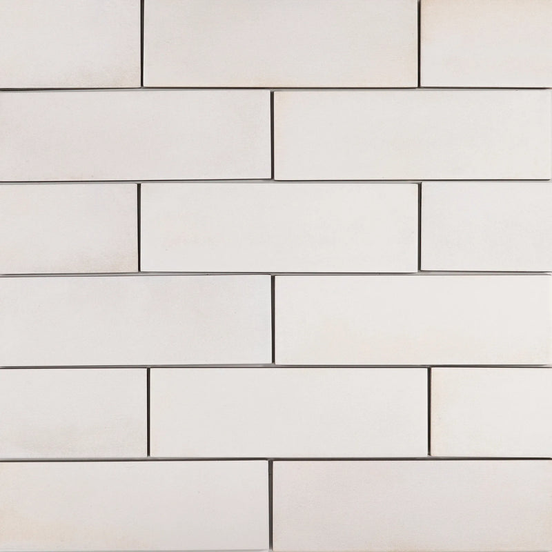 Barely There In The Cloud 8x2 matte ceramic tiles in a white running-bond pattern.