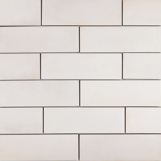 Barely There In The Cloud 8x2 matte ceramic tiles in a white running-bond pattern.
