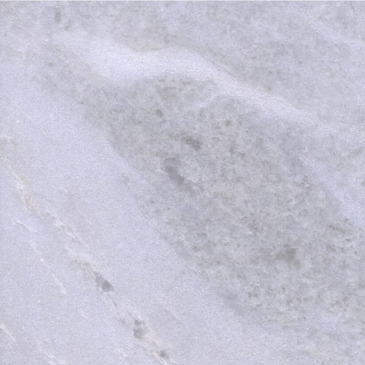Close-up of Bianco Rhino Extra marble with soft white and gray cloud-like veining.
