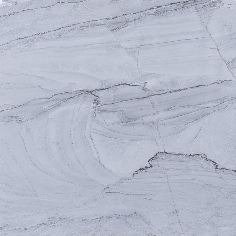 Bianco Supreme honed quartzite with a pale gray surface and fine, flowing gray veins.