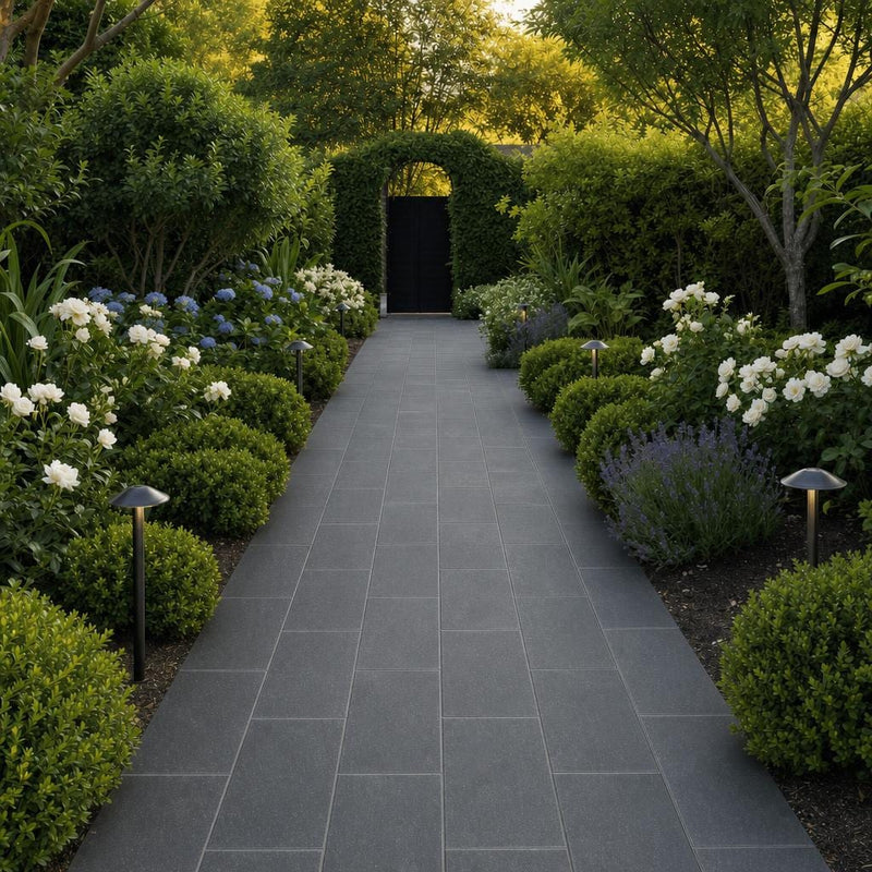 Black Basalt 12x24 Tumbled Stone Paver — Garden path