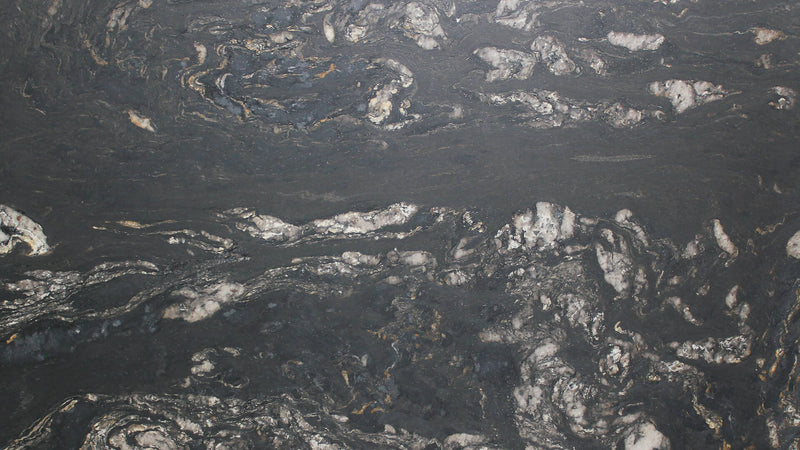 Close-up of Black Cosmic leathered granite with dark gray, silver and subtle gold veining.