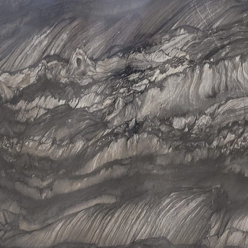 Black Raj quartzite slab with sweeping charcoal-black bands and silver-gray mineral patterns.
