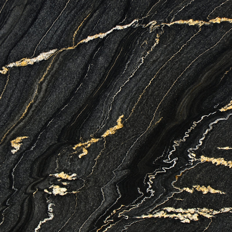 Black Taurus 2cm polished granite slab with a charcoal-black background and flowing gold and ivory veins.