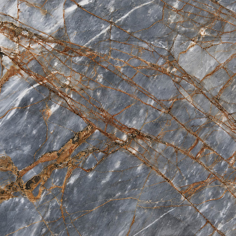 Blue Fire polished marble slab surface with blue-grey tones and intersecting gold, copper and white veins.