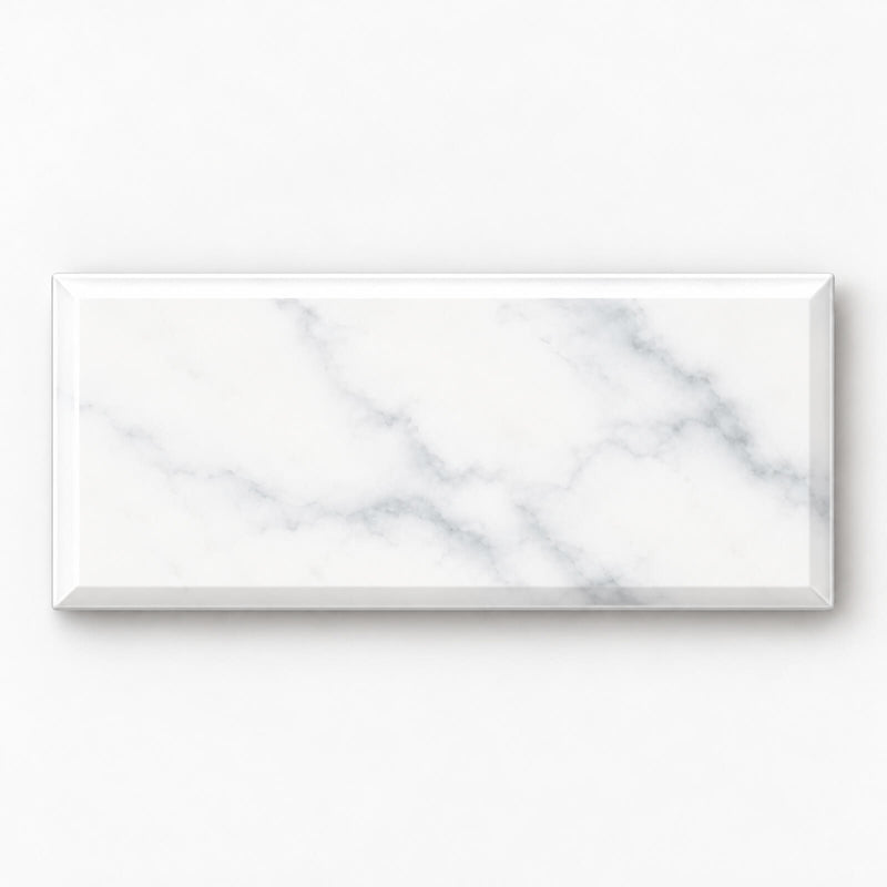 Single Bright Statuary 3x6 beveled ceramic wall tile shown horizontally with subtle gray veining.