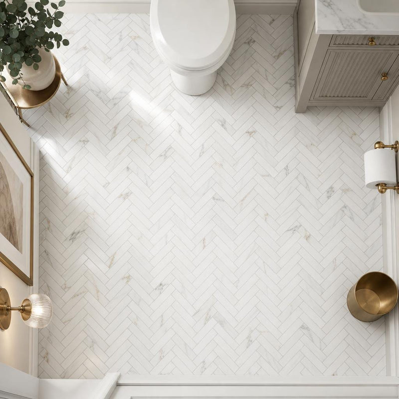 Calacata Gold Herringbone 1x4 Polished Veined Marble Mosaic — Powder Room floor