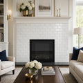 Calacatta Gold 3x6 Deep Beveled Polished Veined Marble Tile — Living Room fireplace surround